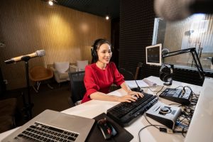 beautiful-woman-working-radio-with-professional-equipmenv