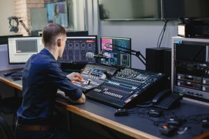 beautiful-woman-working-radio-with-professional-equipmen
